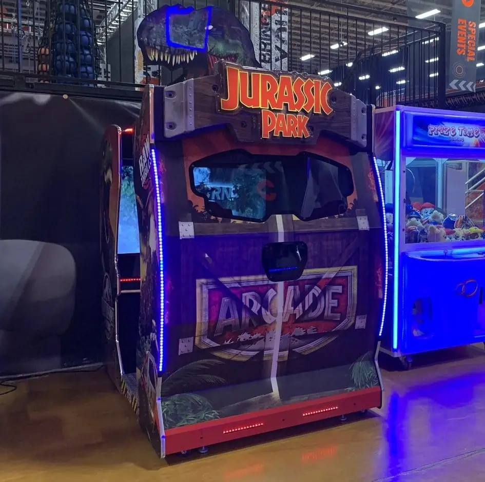 Jurassic Park arcade game and Prize Time claw machine placed by The Arcade Pros at a Sky Zone trampoline park