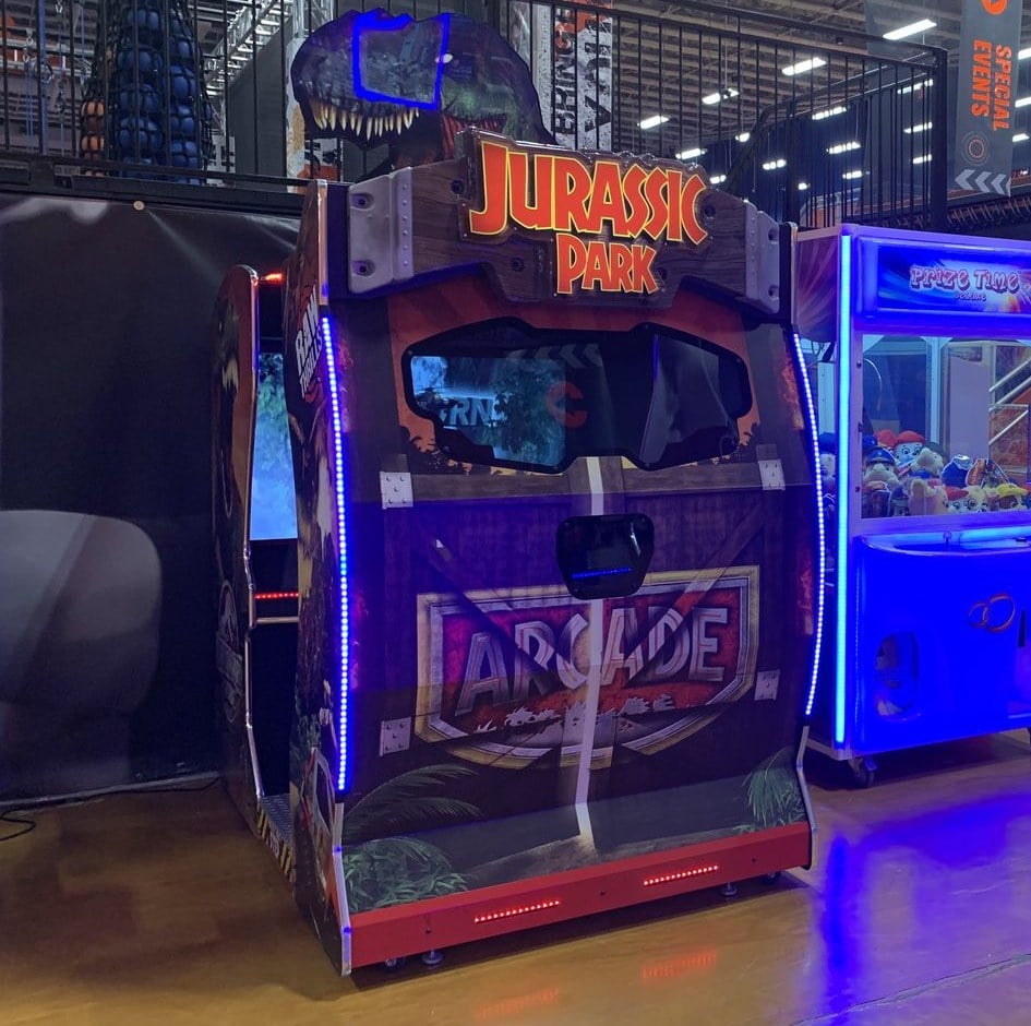 Jurassic Park arcade game and Prize Time claw machine placed by The Arcade Pros at a Sky Zone trampoline park