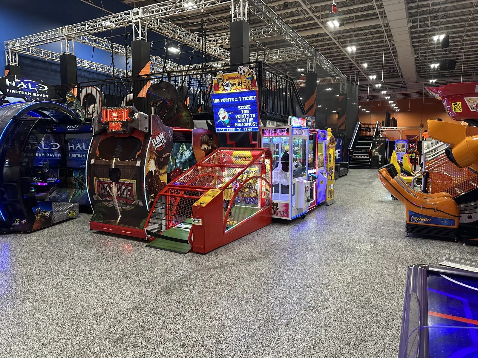 Arcade games and claw machines placed by The Arcade Pros at a sports and entertainment facility